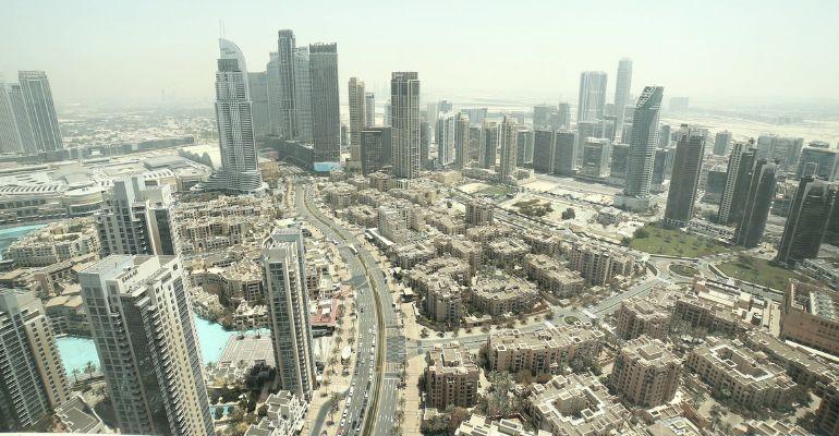 Aerial view of Dubai cityscape with skyscrapers and main road.jpg