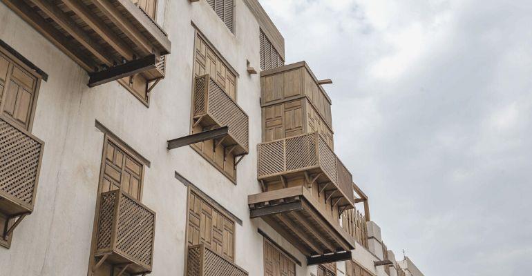 Rustic hotel building exterior in Jeddah Historic District, Saudi Arabia